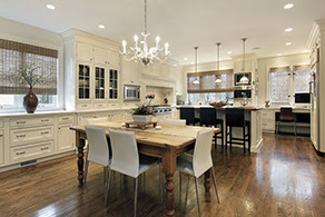 Luxurious modern kitchen with brown hardwood floors